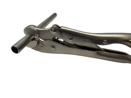 GRIP-IT TOOL holding stainless steel tubing steady while it is cut with a tube cutter